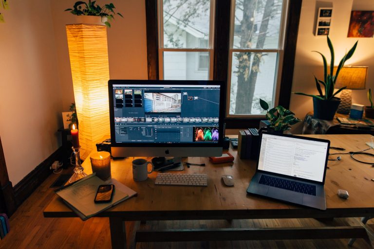 modern workplace with gadgets in cozy room with soft light